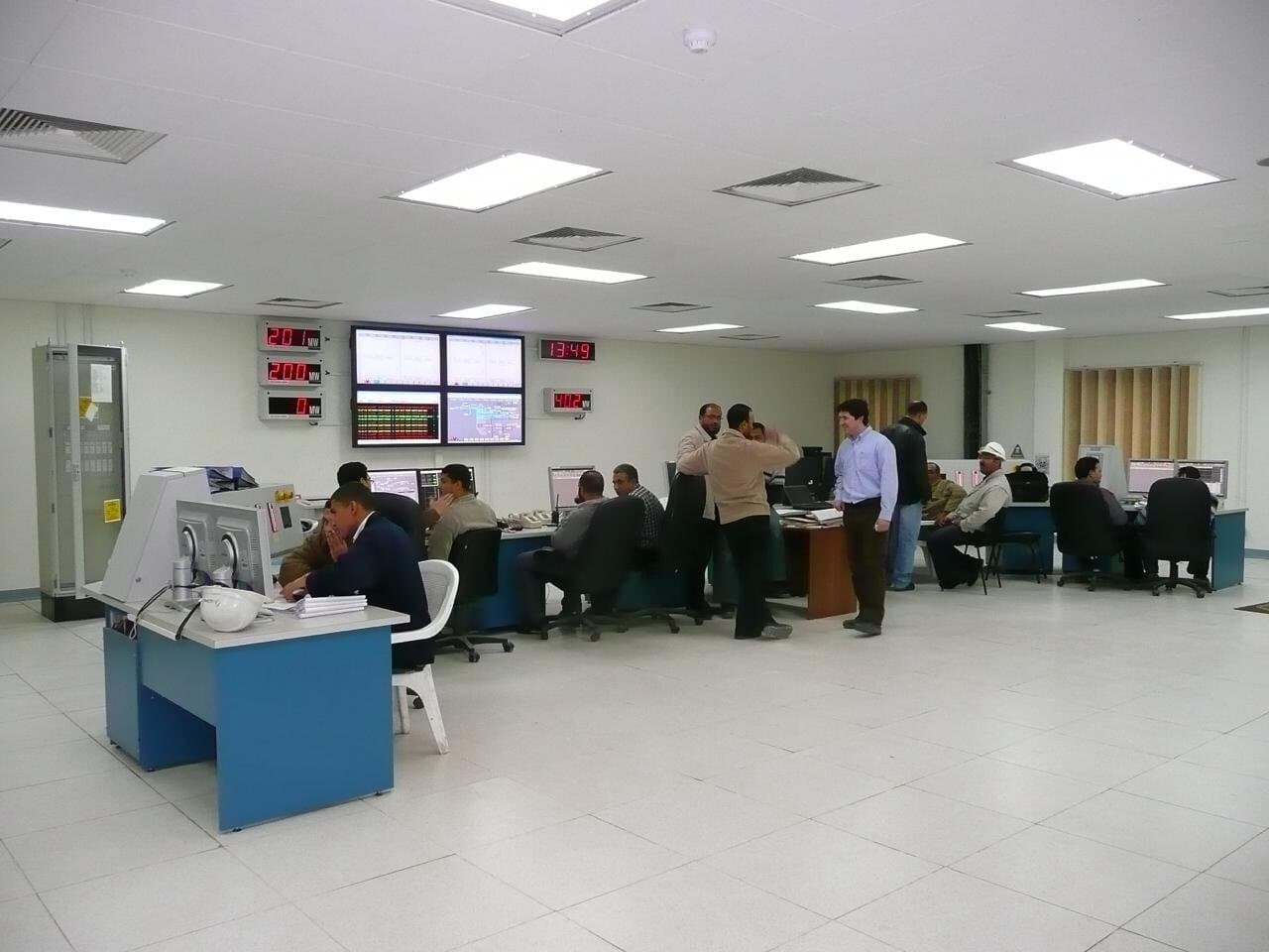 Operators working in a power plant control room